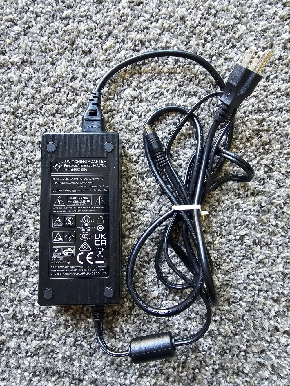 Shenzhen FJ-SW202821007150 switching power adapter.  Input: 100-240V~ 50/60Hz 3